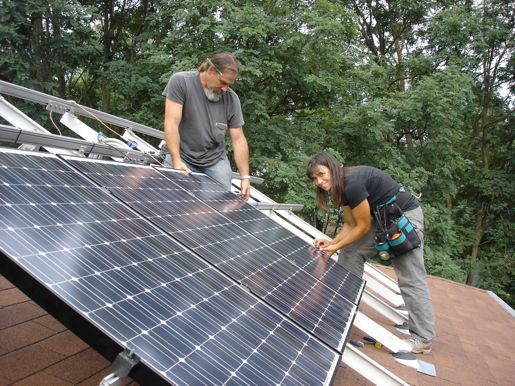 Installing the Boyces' array, courtesy EcoMetro Tour