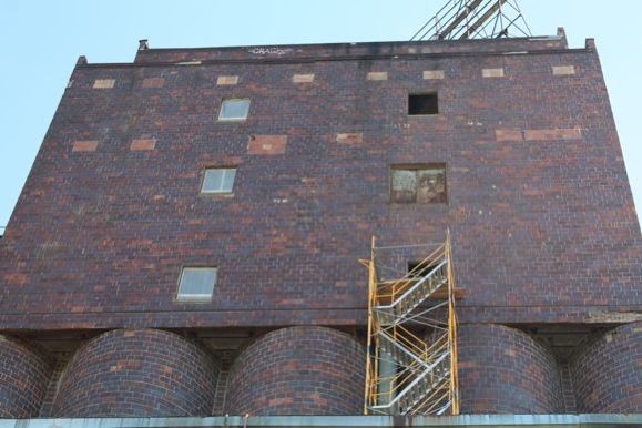 The red-tile building under renovation, courtesy Jennifer Kramer