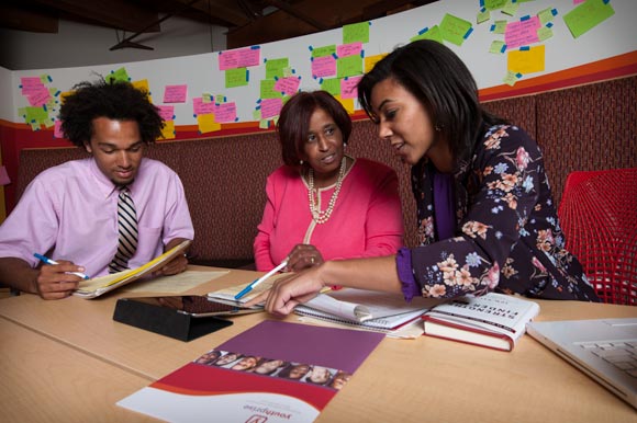 Wokie Weah (center) with YouthPrise interns Tyler Hamblin and Erica Deanes