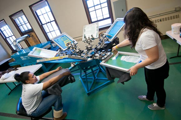 Students screen-printing Forgotten tees