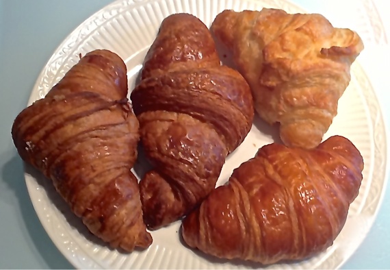 Croissants from (clockwise from left) Patisserie 46, Rustica, Trung Nam, and Chez Arnaud